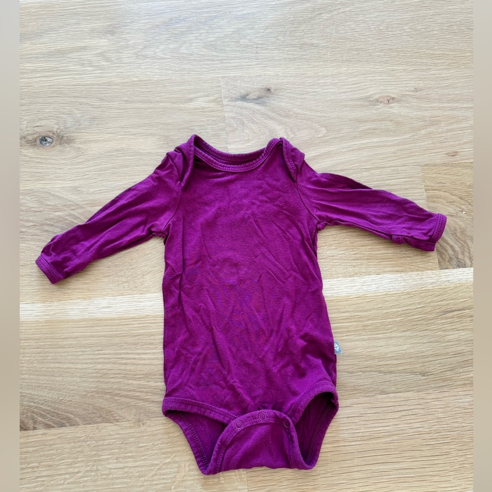 Kyte body suit. Size 0-3 months. Color: purple/magenta